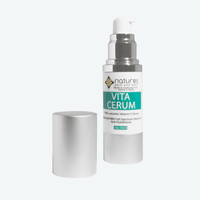 A bottle of VitaCerum Vitamin C Serum with its cap removed, showcasing the label and the clear serum inside.